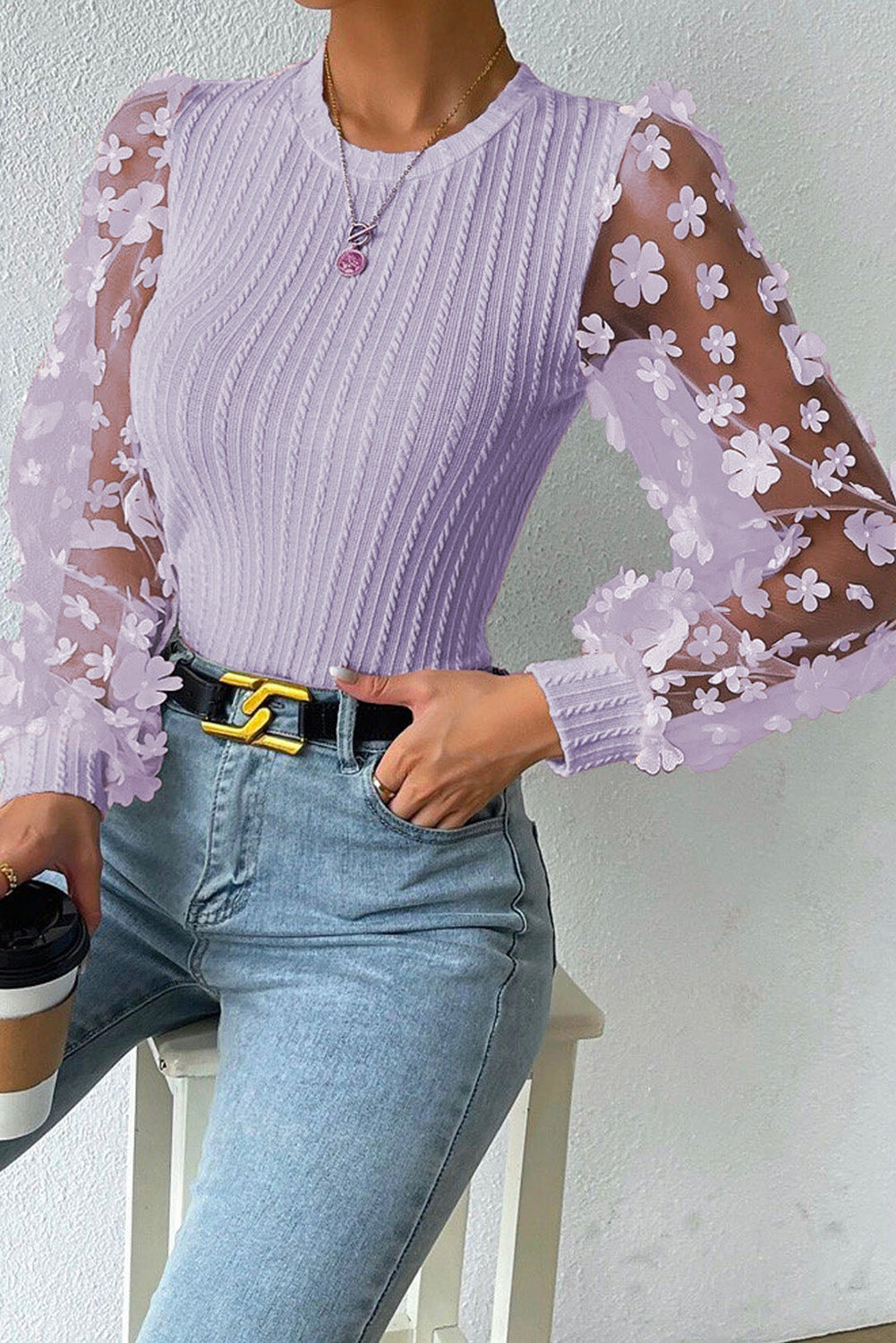 Blusa de manga larga con apliques texturizados