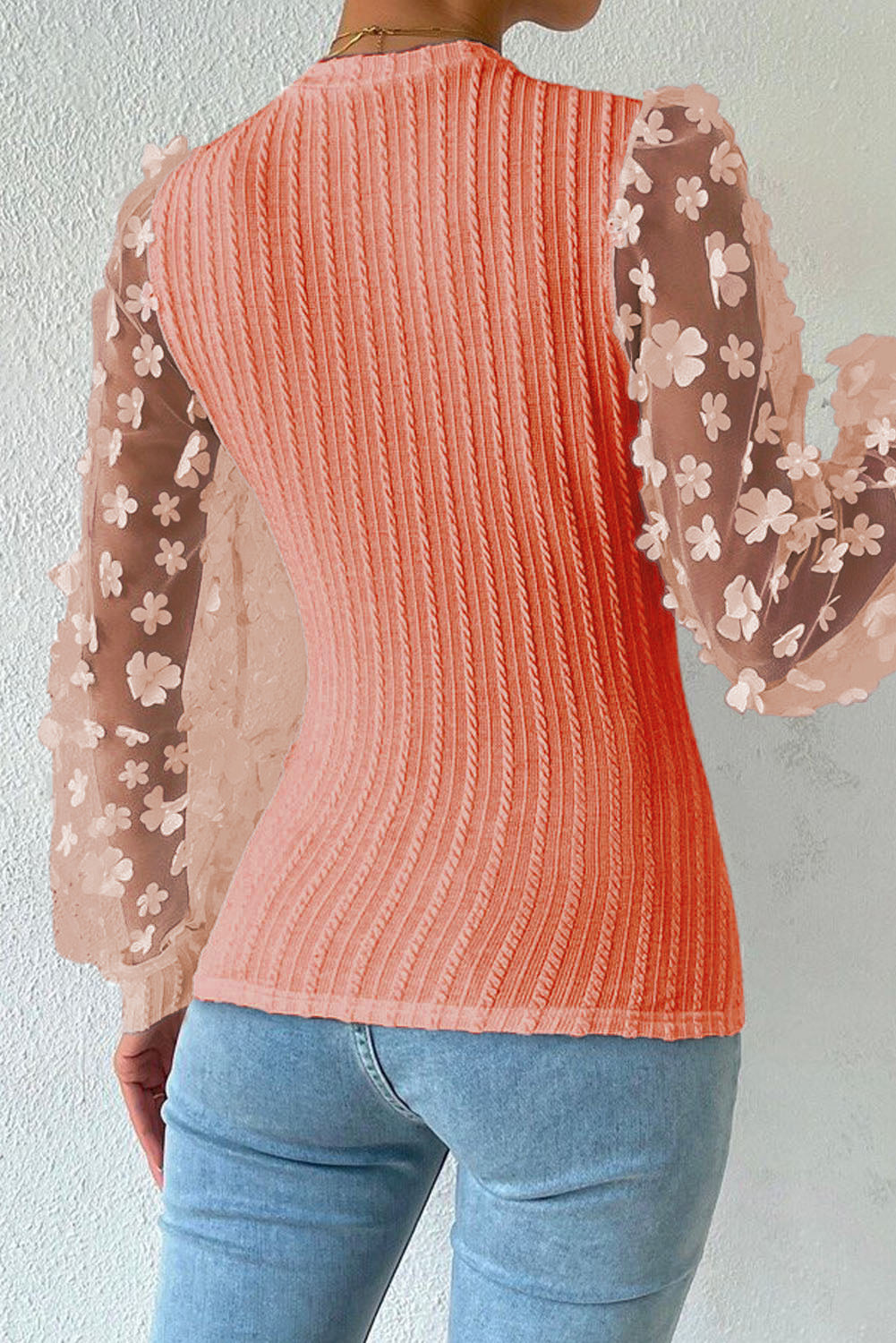 Blusa de manga larga con apliques texturizados